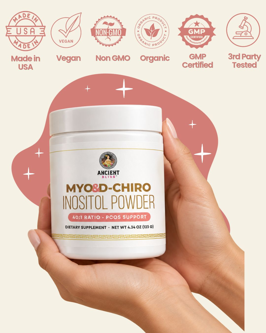 Ancient Bliss Myo & D-Chiro Inositol Powder jar held in two hands on a cream and coral background